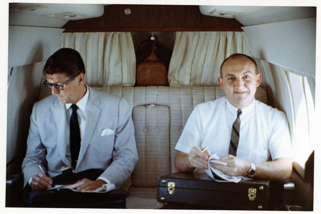Governor aboard airplane