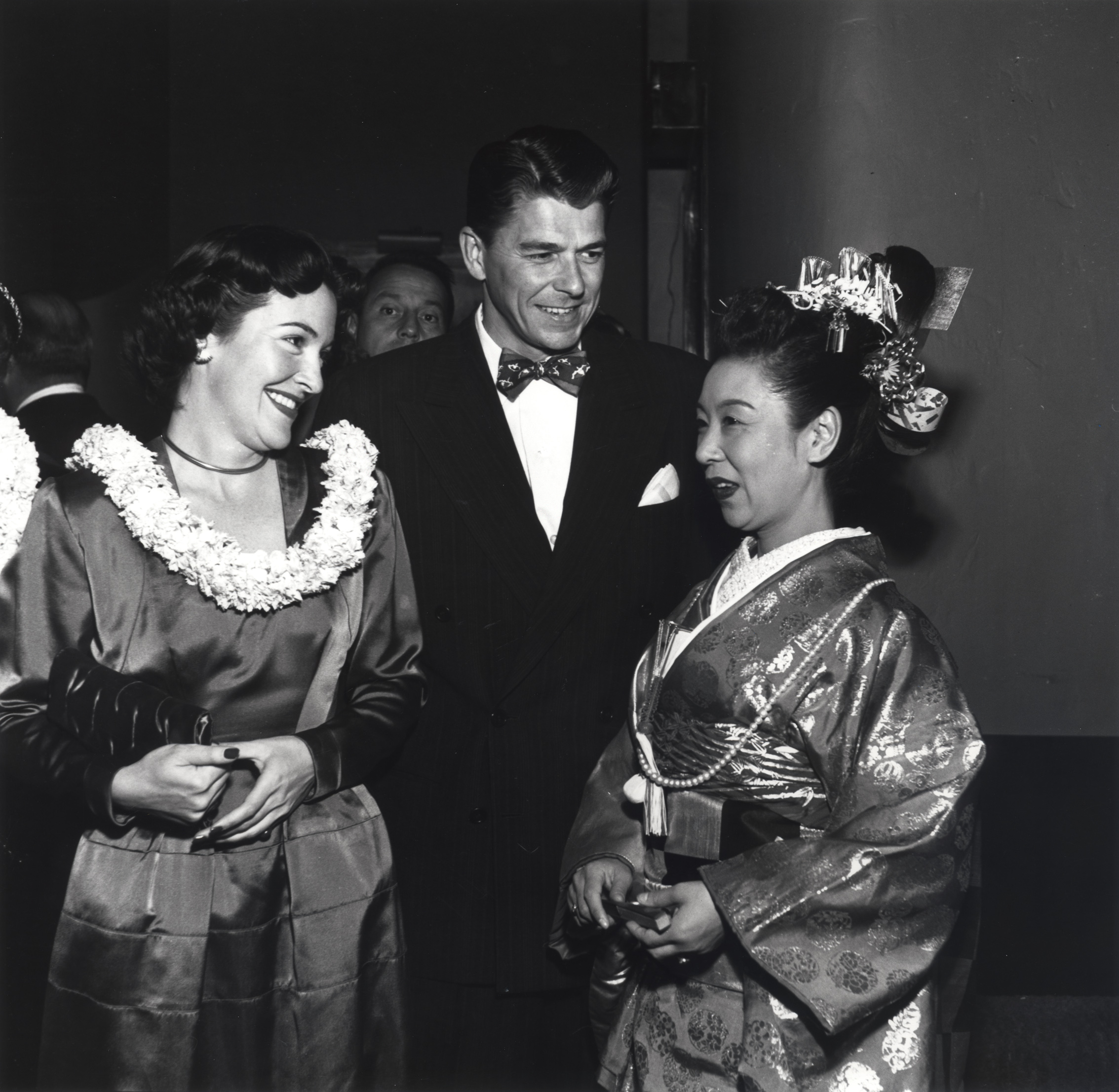 Ronald Reagan and Nancy Davis, wearing a lei