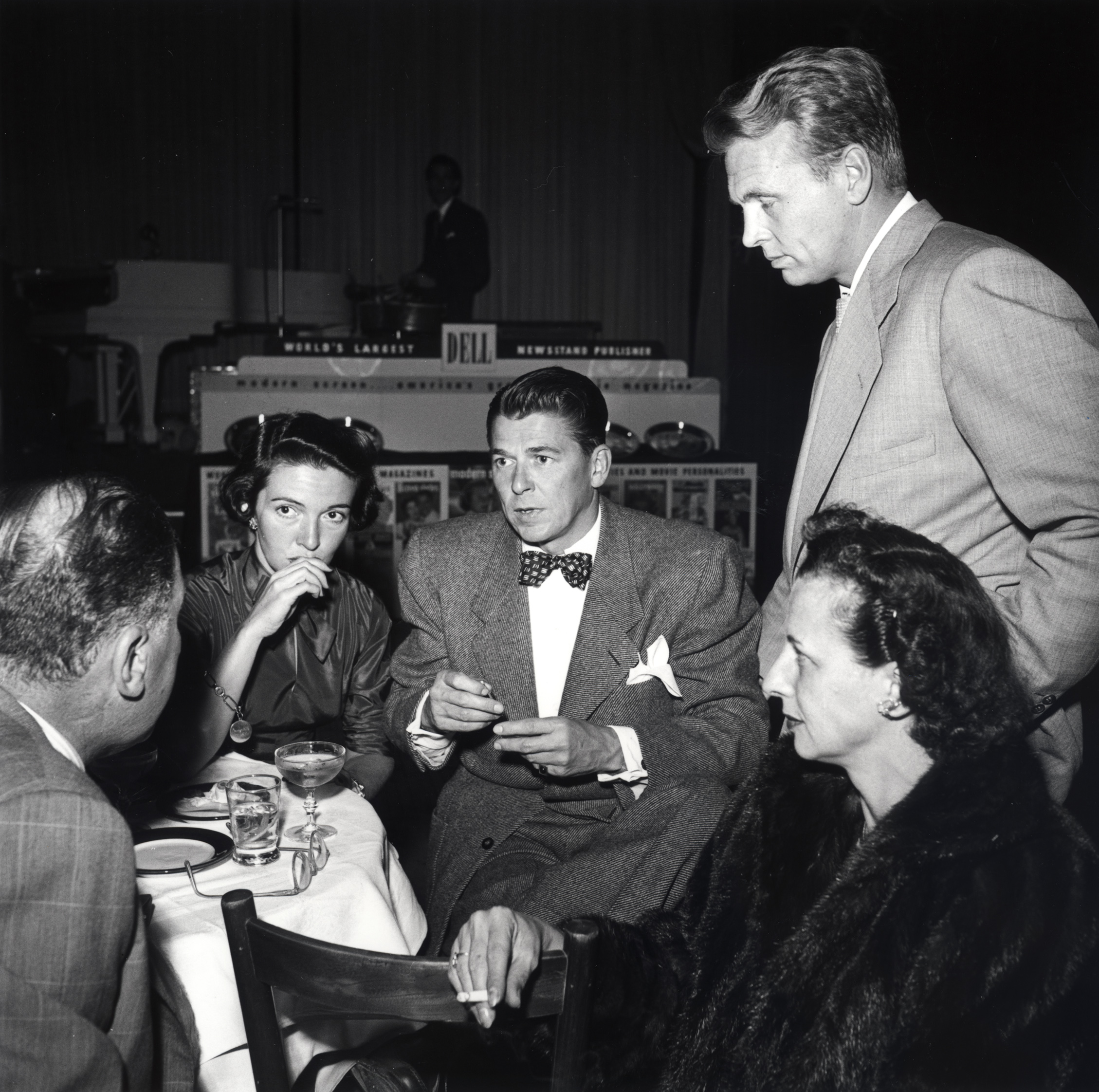 Ronald Reagan and Nancy Reagan talking to an unidentified man