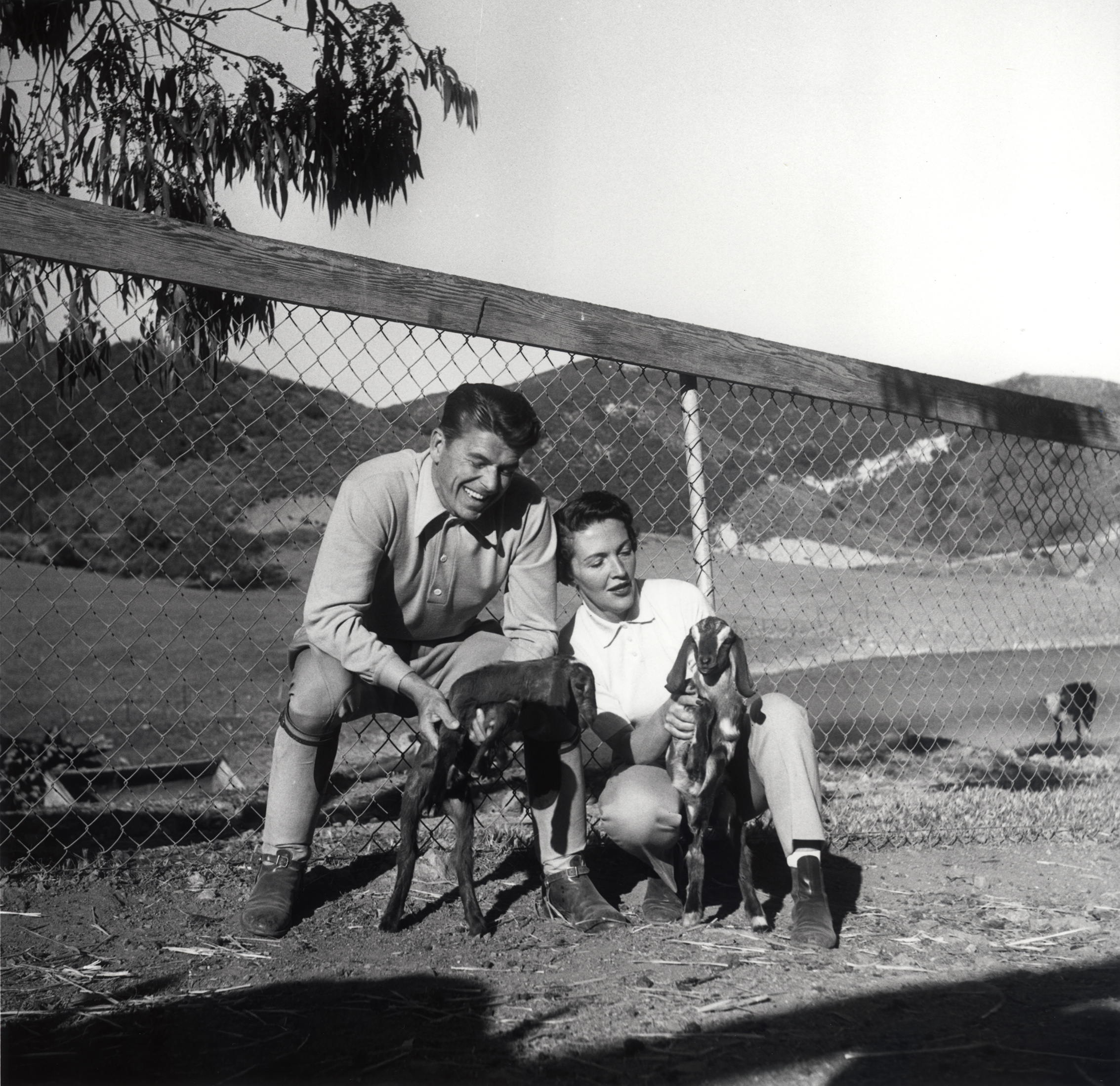Ronald Reagan and Nancy Reagan posing with their goats “Nubie” and “Heidi” at Malibu Canyon Ranch