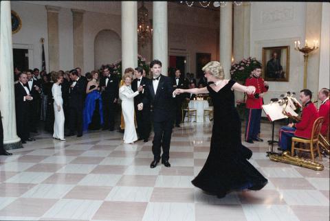 11-9-1985 John Travolta dancing with Princess Diana at a Dinner for Prince Charles and Princess Diana of the United Kingdom in the entrance hall