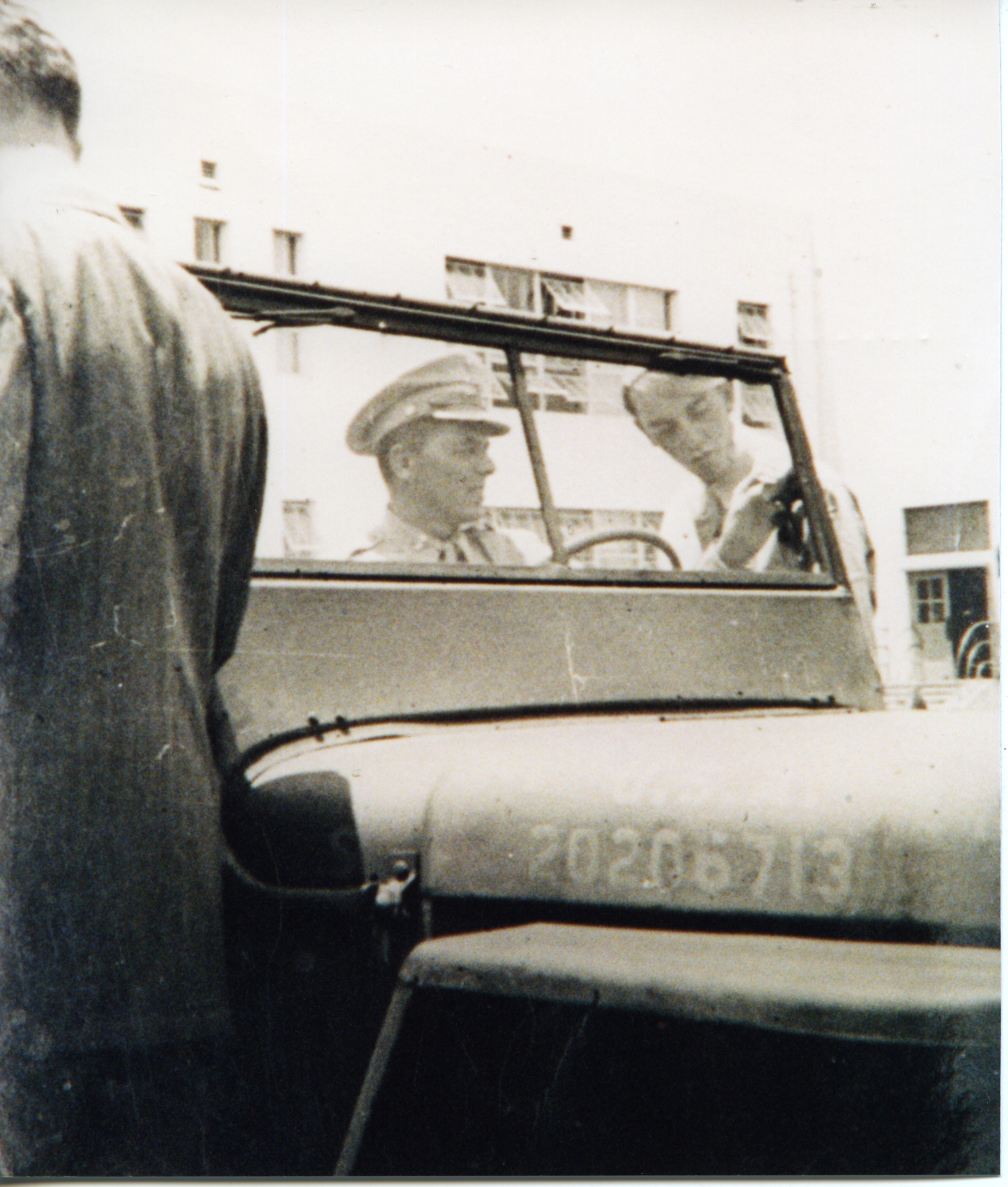Ronald Reagan in military uniform sitting in a jeep (circa 1944) visiting Emerson Junior High school