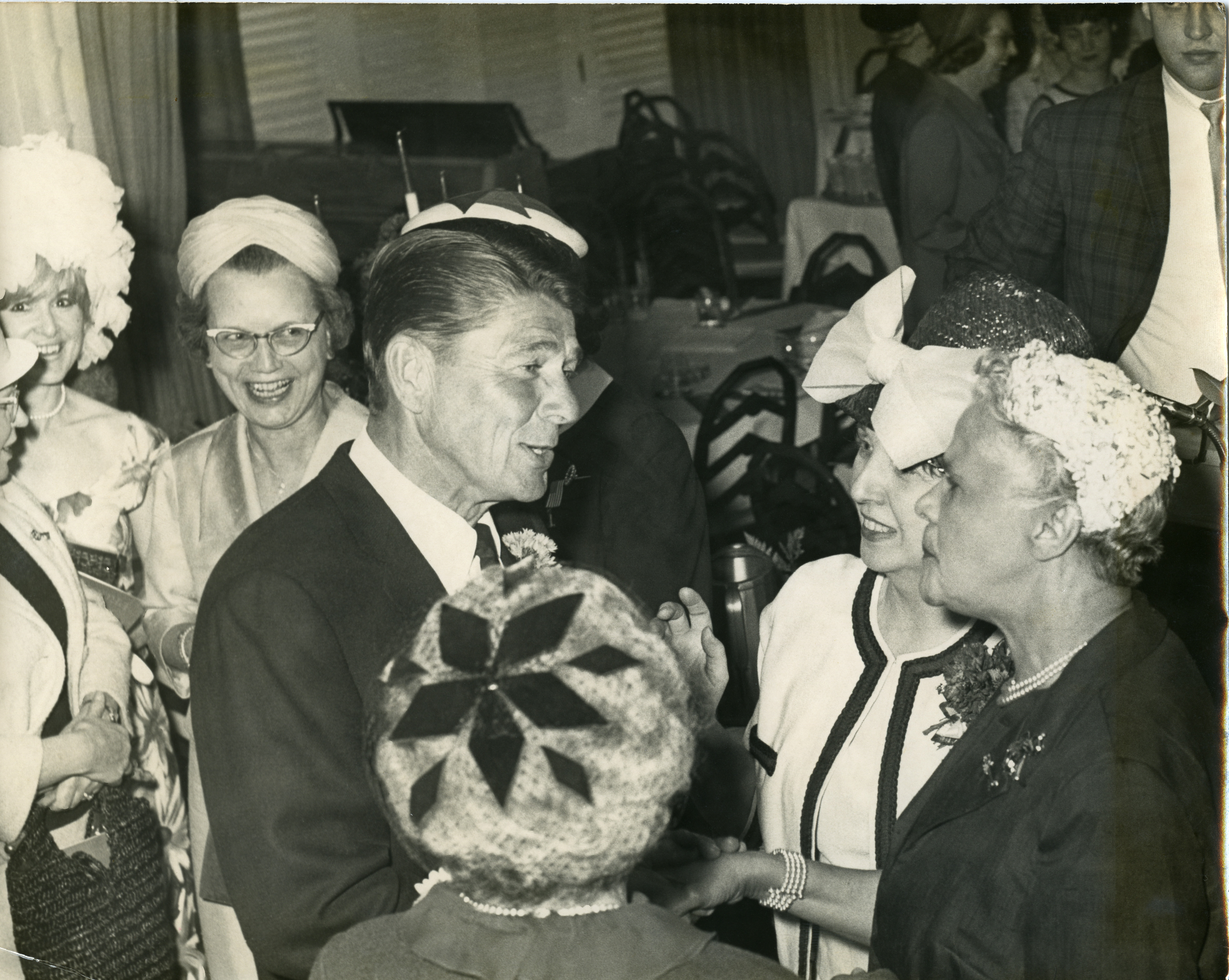 Ronald Reagan talking to women at unknown event, 1960s