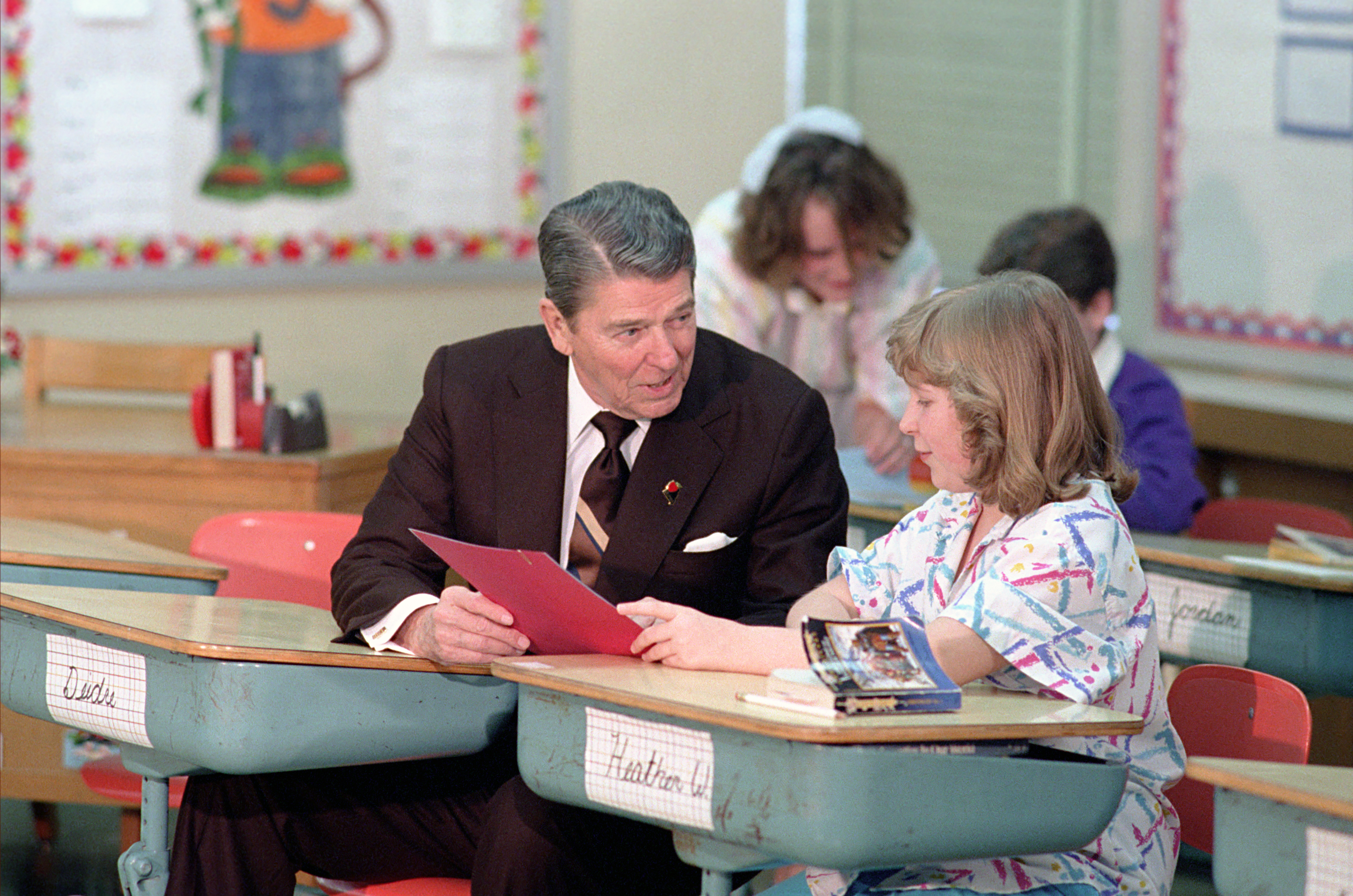 President Ronald Reagan Sitting at a Desk During a Trip to Columbia Missouri and a Visit to Fairview Elementary School