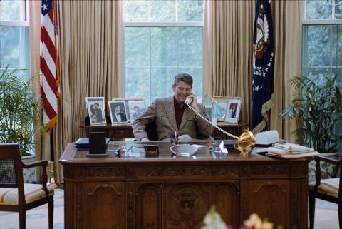 talking on telephone