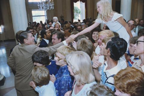 shaking hands with child visitor