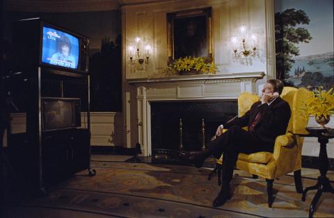 Talking on telephone to Space Shuttle astronauts including Sally Ride and Robert Crippen