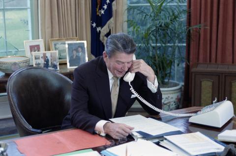 talking on telephone