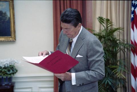President reading in oval office