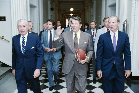 holding football