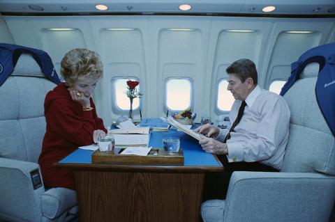 President and Nancy Reagan studying aboard Air Force One