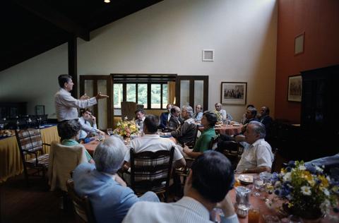 President Reagan with congress at Camp David
