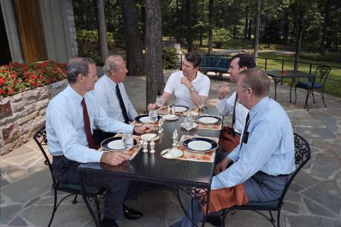 President Reagan meeting with staff at Camp David