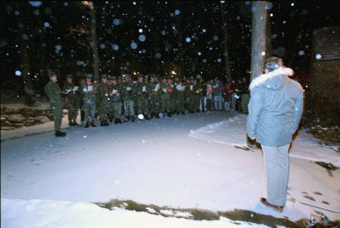 President Reagan listening to military carolers at Camp David