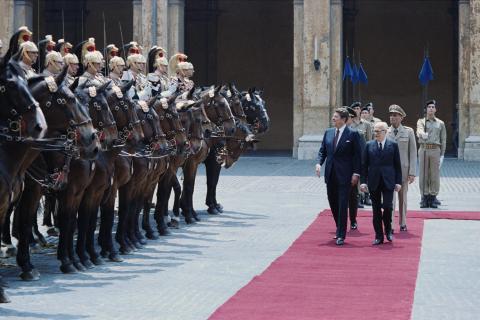 President reviewing troops and horses during visit to the Quirinale Palace