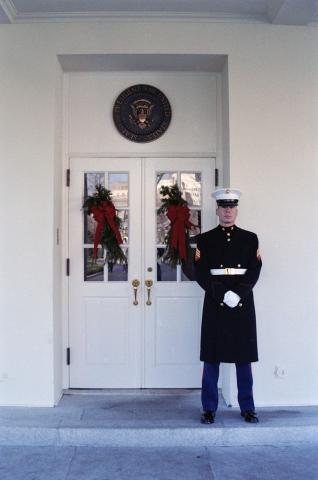 Marine guard standing at the door of the West Wing Lobby