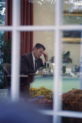President sitting at his oval office desk