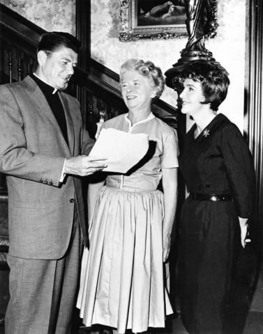 H109, Ronald Reagan and Nancy Reagan on the set of General Electric episode "Money and the Minister's Wife" with writer Charlotte Armstrong. 11/26/1961.