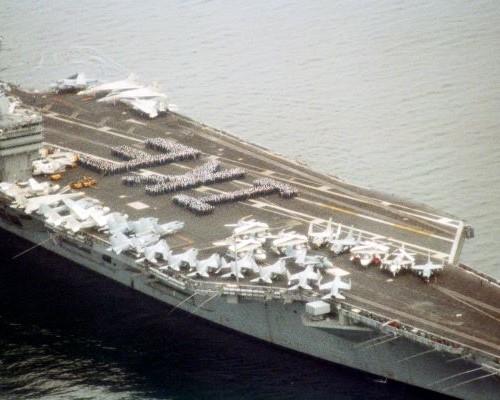 US Navy aircraft carrier USS Eisenhower (CVN-69) spelling out "Ike" with sailors on deck