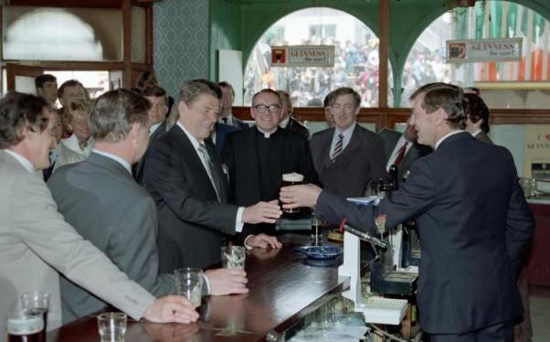 President Ronald Reagan receiving a beer during a visit to O’Farrell’s Pub in Ballyporeen, Ireland 06/03/1984 