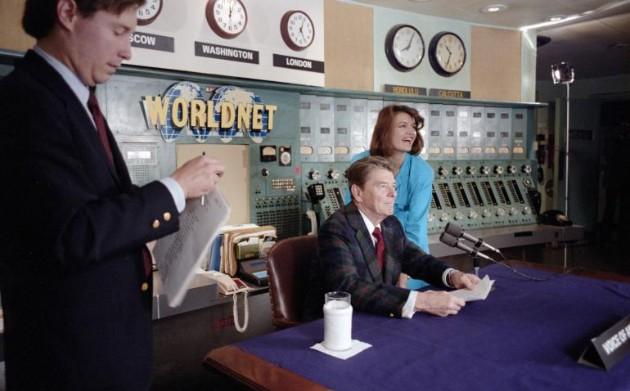 President Ronald Reagan with Elizabeth Board and Jim Kuhn before his Radio Address to the Nation and the World on the Upcoming Soviet-United States Summit Meeting in Geneva from the Voice of America Building in Washington, D.C., 11/09/1985 C31870-03
