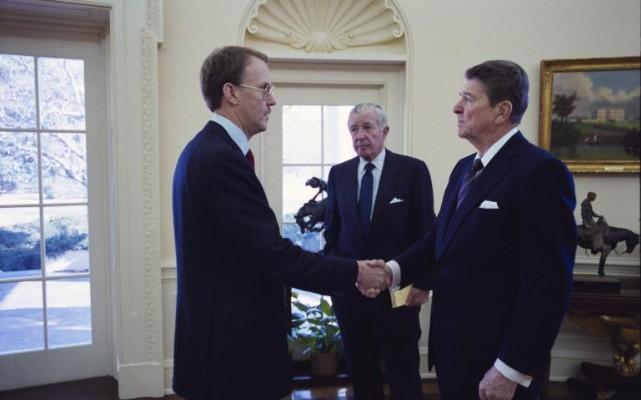 President Ronald Reagan meeting with acting administrator of the National Aeronautics and Space Administration (NASA)William Graham, along with Chief of Staff Don Regan, in the Oval Office 01/28/1986