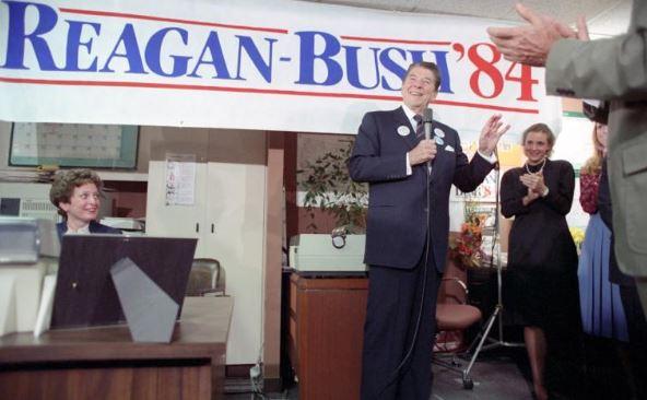 President Ronald Reagan speaking to staff while visiting the Reagan-Bush Campaign Headquarters in Washington, D.C. 10/31/1984 