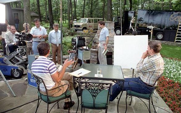 President Ronald Reagan sitting with Ken Khachigian during a filming session for the Tuesday Team and the 1984 campaign documentary at Camp David 07/08/1984 