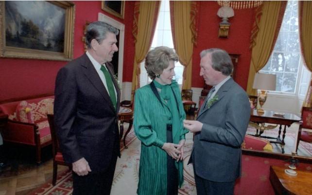 President Ronald Reagan and Nancy Reagan talking with Prime Minister Charles Haughey of Ireland in the Red Room during St. Patrick’s Day 03/17/1982 