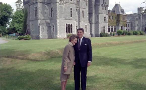 President Ronald Reagan and Nancy Reagan standing in front of Ashford Castle, Ireland 06/02/1984 