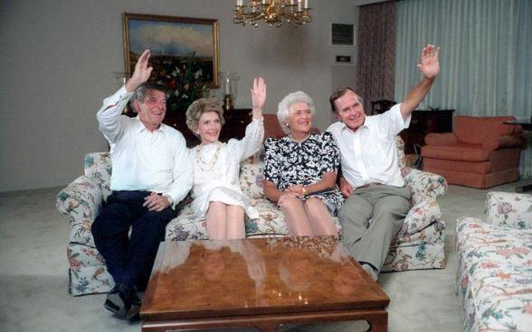 President Ronald Reagan, Nancy Reagan, Barbara Bush, and Vice President George Bush waving to the crowd at the Republican National Convention via satellite in Dallas, Texas 08/22/1984 