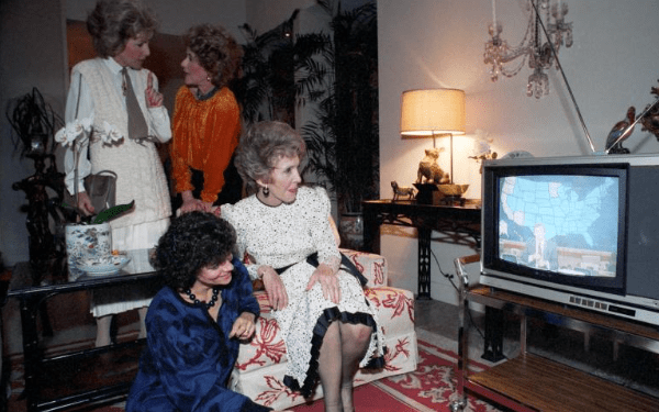 Nancy Reagan sitting watching television during a private dinner at the Jorgensen residence in Los Angeles, California 11/06/1984 