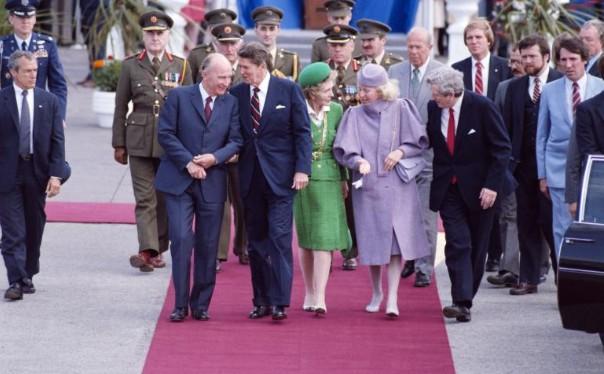 President Ronald Reagan and Nancy Reagan walking with Prime Minister Garret FitzGerald of Ireland, President Patrick Hillery of Ireland, and Maeve Hillery prior to their departure from Dublin Airport, Dublin, Ireland, 06/04/1984