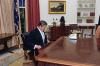 President Ronald Reagan looking in the Resolute Desk after the Inaugural Parade 01/20/1981 NAID: 75852417