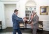 President Ronald Reagan greets Ralph McKinzie, his former football coach at Eureka College, in the Oval Office 07/23/1981 C3185-2 NAID: 404525275