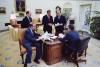 President Ronald Reagan holding a staff meeting in the Oval Office on his first full day in office Left to right: Deputy Chief of Staff Michael Deaver, Counsellor to the President Edwin Meese, Chief of Staff James Baker, and Press Secretary James Brady 01/21/1981 A NAID: 12013683