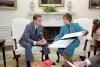  President Ronald Reagan listing to Director of the Peace Corps Loret Ruppe during a national security briefing in the Oval Office 07/21/1982 NAID: 276563505