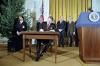 President Ronald Reagan signing Proclamations 5003 and 5004 to Commemorate Human Rights Week and the First Anniversary of Martial Law in Poland in the East Room 12/10/1982  NAID: 75852547