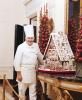 Chef Hans Raffert posing with the gingerbread house 12/13/1983 