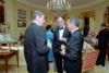 President Ronald Reagan and Vice President George Bush talking with President Jorge Blanco of the Dominican Republic in the Yellow Oval Room during the state dinner 04/10/1984  NAID: 276563827