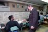 President Ronald Reagan during a drop-by with the White House switchboard operators and signal staff in the White House 12/22/1986  NAID: 404525347