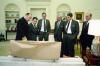 President Ronald Reagan meeting in the Oval Office with staff regarding the Libya air strike Left to right: Admiral Crowe, Secretary of Defense Caspar Weinberger, Vice President George Bush, Chief of Staff Donald Regan, and Assistant to the President for National Security Affairs John Poindexter 03/24/1986 NAID: 75854689