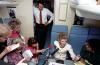 Nancy Reagan speaking with the press aboard the First Lady airplane during a trip to the G7 Summit in Venice, Italy 06/10/1987  NAID: 75855493