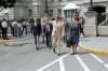 President Reagan walking from the Old Executive Office Building (OEOB) to the White House with military aide Vivien Crea, Dr. Hutton, and Marlin Fitzwater 08/03/1987  NAID: 276564533