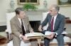President Ronald Reagan listening to Secretary of Interior Donald Hodel during a briefing on the Yellowstone forest fire in the Oval Office 08/01/1988  NAID: 75856221