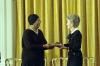 Nancy Reagan presenting the Presidential Medal of Freedom to actress and singer Pearl Bailey in the East Room 10/17/1988 NAID: 276564995 