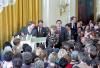 President Ronald Reagan and Nancy Reagan receiving a dog house for Rex during the White House Staff Farewell Ceremony in the East Room 01/18/1989  NAID: 75856461