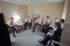 Senior staff watching the second presidential debate on defense and foreign policy with James Baker, Senator Paul Laxalt, Larry Speakes, Richard Darman, Robert McFarlane, and Roger Ailes at the Kansas City Convention Center Holding Room, Kansas City, Missouri 10/21/1984