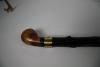 A blackthorn walking stick used by the donor in 1984 St. Patrick’s Day parade in Dublin, Ireland. An engraved brass collar states: “PRESIDENT RONALD REAGAN, HONORARY GRAND MARSHALL, ST. PATRICK’S DAY PARADE, DUBLIN 1984.” At the base of the base of the walking stick is a silver ferrule.  Gifter:Robert J. Flynn. Artifact ID: 1987.04080.01
