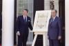 President Ronald Reagan and President François Mitterrand of France with the original deed of gift for the Statue of Liberty on the front steps of the Admiral’s House on Governors Island in New York Harbor 07/04/1986